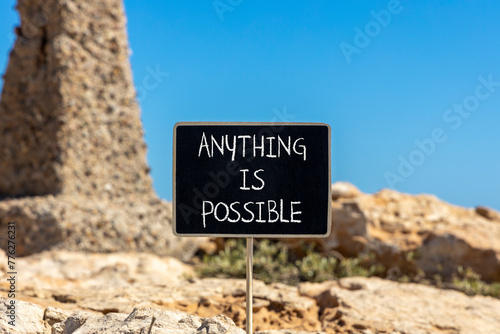 Anything is possible symbol. Concept words Anything is possible on beautiful black chalk blackboard. Beautiful red stone blue sky background. Business anything possible concept. Copy space.