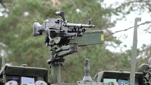 Adazi, Valmiera - April, 4, 2024 - Nato 75 anniversary. Close-up of a mounted machine gun on a military vehicle.