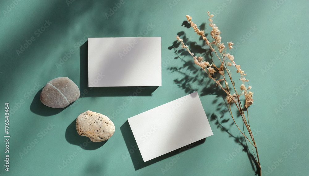 Φωτογραφία Blank paper sheet card with mockup copy space and dry floral branch and blanket cloth on neutral green background
