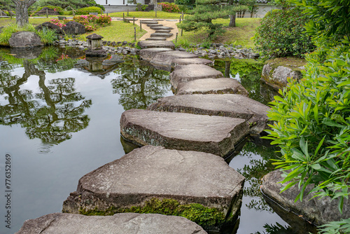 Large flat rocks forming a path over a Japanese pond.
Koko-en zen garden near Himeji castle.
