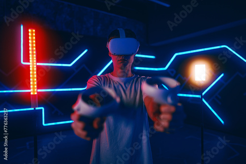 Cyber gamer in virtual reality glasses.