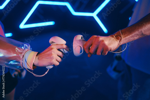 Controllers for vr games in the hand of two players.