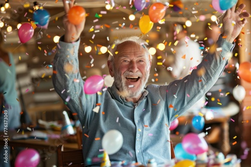 Portrait of a happy senior man having fun during a birthday party photo