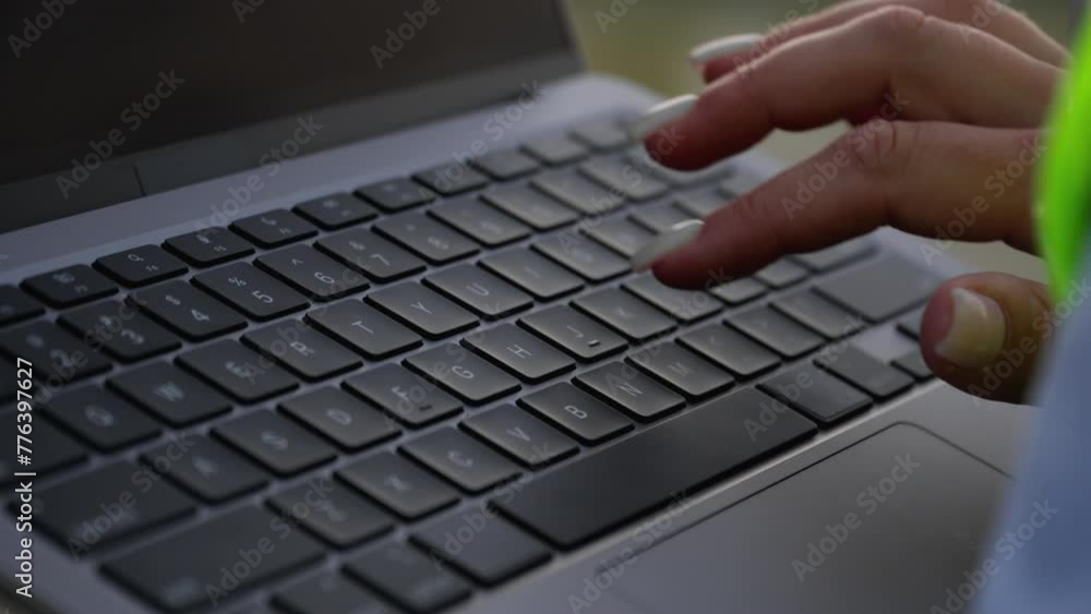 Working on a laptop. Successful technical project: An engineer performs an inspection of a wind farm, demonstrating vigorous stability and professional competence. Working on a laptop. Successful technical project: An engineer performs an inspection of a wind farm, demonstrating vigorous stability and professional competence.