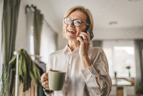 portrait of mature woman make a phone call at office happy smile