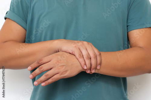 Holding hand man with pain in muscles and joints,Symptoms of peripheral neuropathy and numbness in the fingertip and palm,Diseases caused by side effects of vaccination,Guillain Barre Syndrome(GBS)  photo