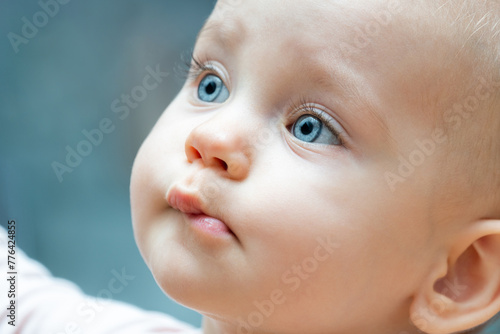 Portrait of beautiful baby girl with blue eyes