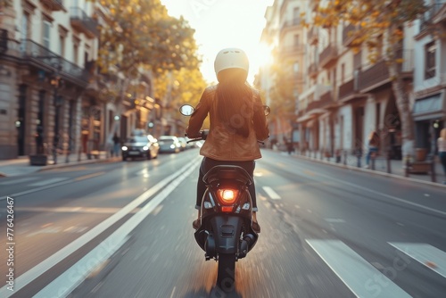 The image captures a rear view of a scooter rider in motion, with the city's architecture and sunset in the background photo