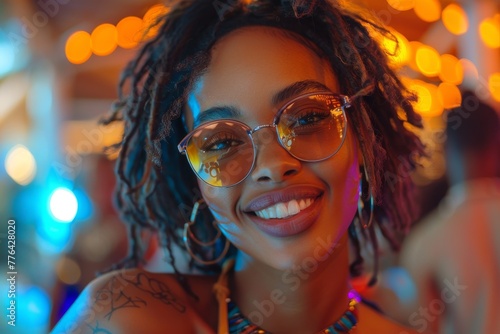 Stylish woman with eyeglasses and curly hair smiling in a neon-lit bar or club