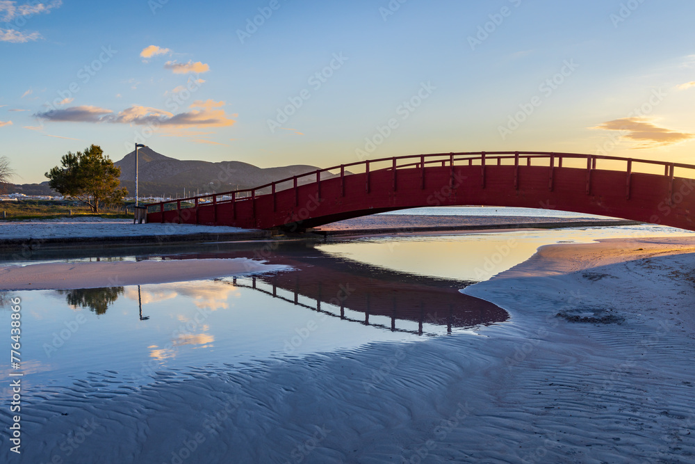 Red footbridge at Alcudia beach, Majorca island, Spain