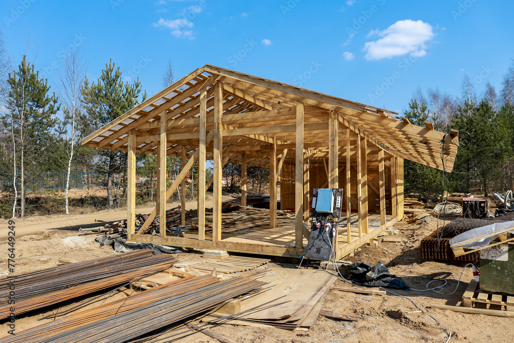 Construction of a house made of laminated veneer lumber. The frame of the house. Cottage made of laminated wood. Erection of the frame of the cottage. Manufacture of houses made of wood