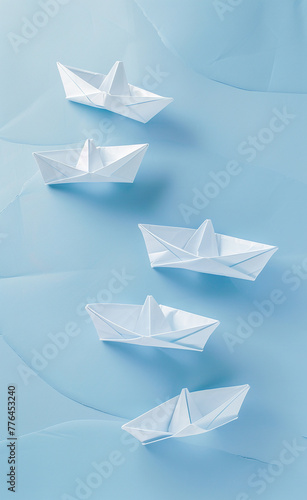 A series of paper boats arranged on a light blue-AI generated image  