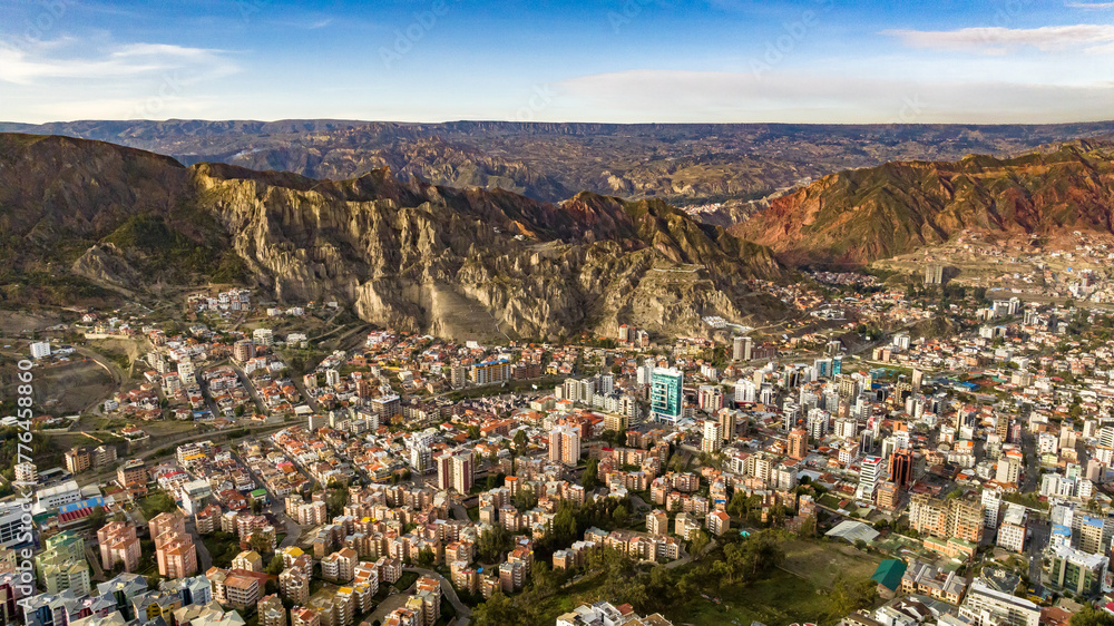 Naklejka premium La Paz, Bolivia, aerial view flying over the dense, urban cityscape. San Miguel, southern distric