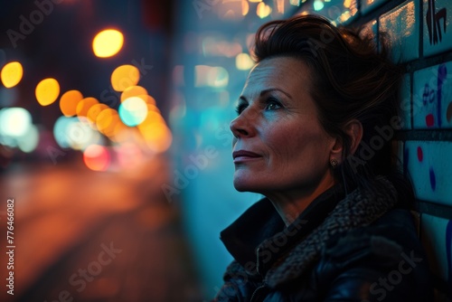 Portrait of a middle-aged woman in the city at night.