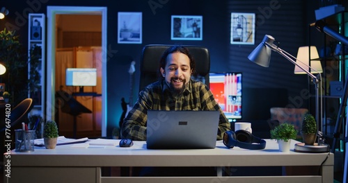 Man checking up on abroad living friend during video conference meeting over the internet. Caucasian person enjoying time together with mate in online video call session while at home, camera B