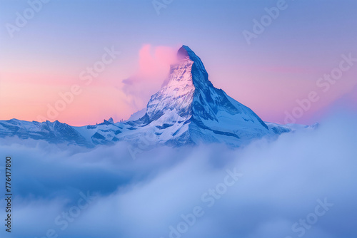 Serene Mountain Peak at Sunrise with Soft Clouds