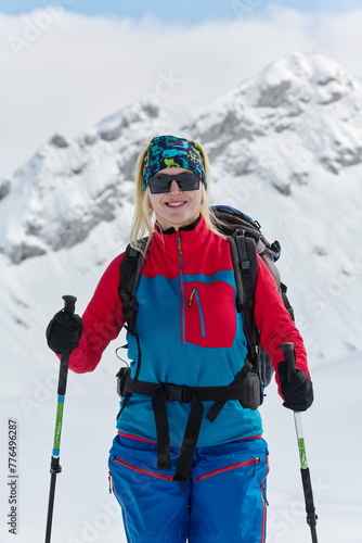 A Female Mountaineer Ascends the Alps with Backcountry Gear