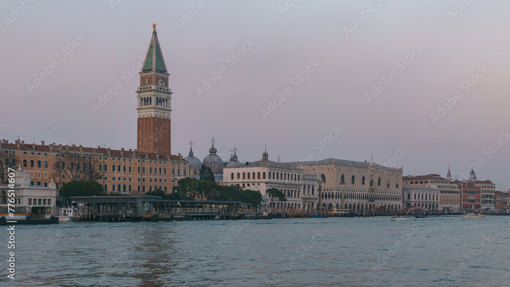 Panoramic view from sea of Piazza San Marco Campanile and Doge Palace on a hazy winter evening, Venice, Veneto, Italy