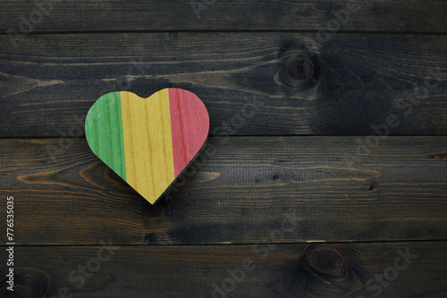 wooden heart with national flag of mali on the wooden background.