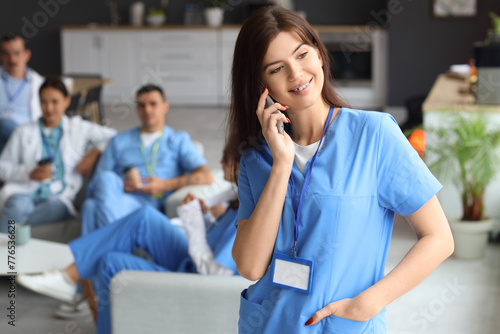 Female doctor talking by mo...