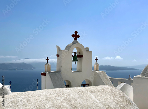 Bell tower in the town of Oia on the rocky shores of Santorini island