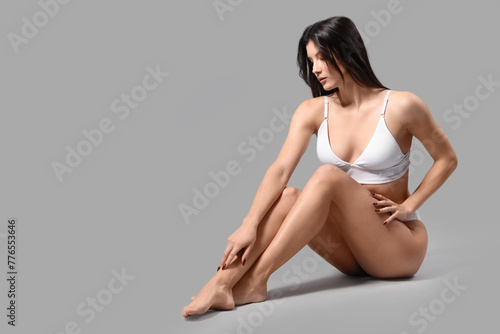 Pretty young woman in white...