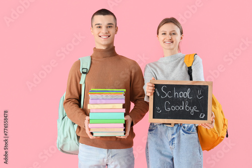 Students holding books and ...