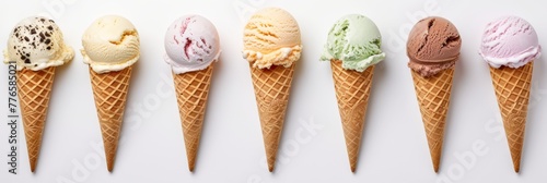 Assorted ice cream cones on a light background
