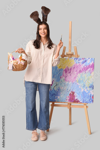 Happy female artist in bunn...