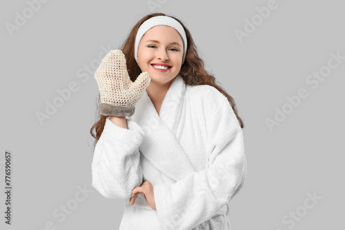 Smiling young woman in whit...