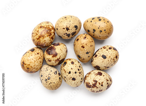 Many fresh quail eggs on white background