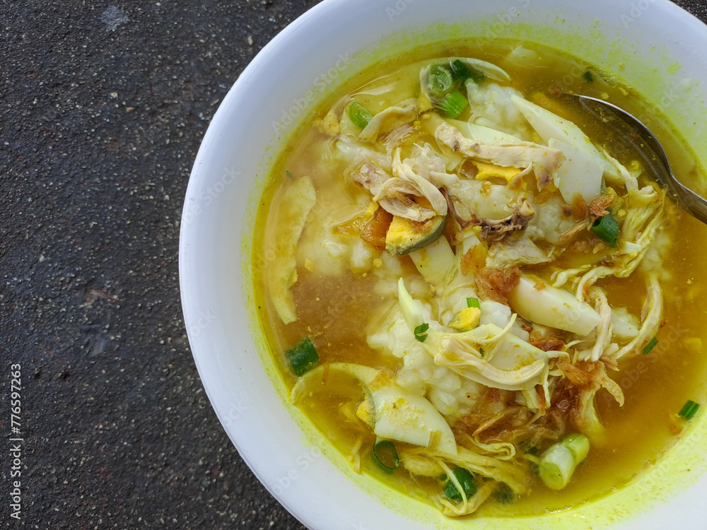 Delicious porridge gravy. Porridge or chicken porridge in Indonesian native called bubur ayam is a popular breakfast menu Delicious porridge gravy. Porridge or chicken porridge in Indonesian native called bubur ayam is a popular breakfast menu