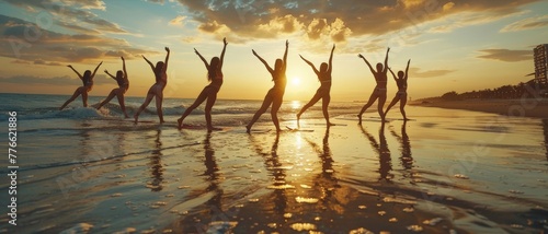 a dynamic yoga session at sunrise, where a group of young women perform synchronized poses on a serene beach, reflecting harmony between body, mind, and nature. photo
