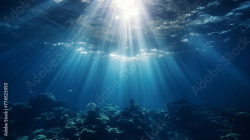 Underwater Sunlight Beams Casting on Rocky Seabed © heroimage.io