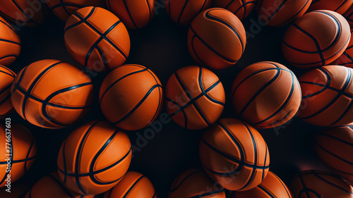 Multiple basketballs on a dark background, highlighting texture and form.