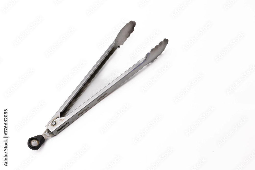 Stainless steel kitchen tongs on white background Stainless steel kitchen tongs on white background