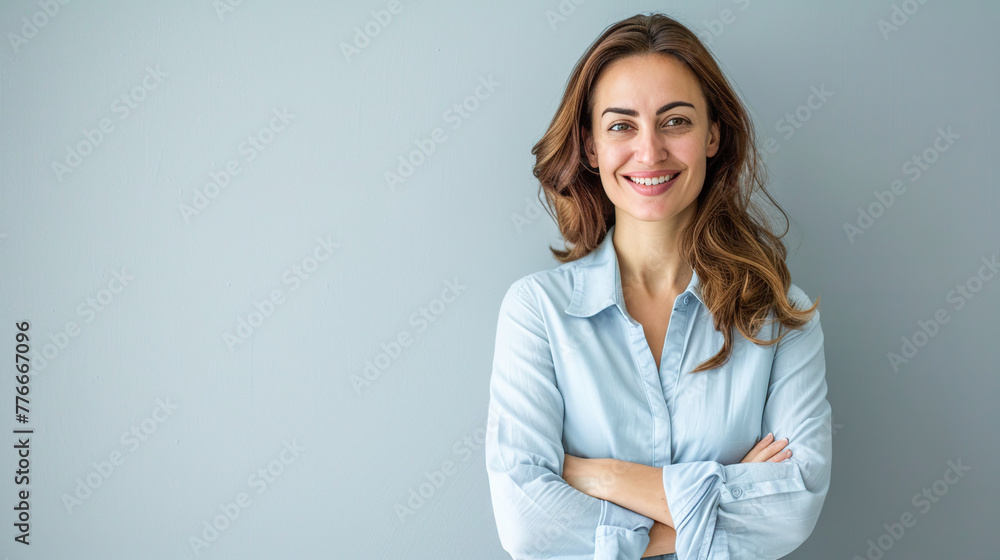 Happy young smiling confident professional business woman wearing blue shirt, pretty stylish female executive looking at camera, standing arms crossed isolated at gray background, Generative AI Happy young smiling confident professional business woman wearing blue shirt, pretty stylish female executive looking at camera, standing arms crossed isolated at gray background, Generative AI