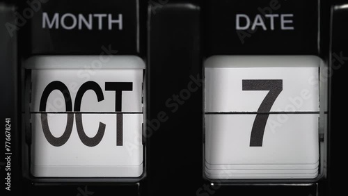 retro flip calendar with a date change from the sixth of October to the seventh of October. daily calendar with a change of days of the month. close up.