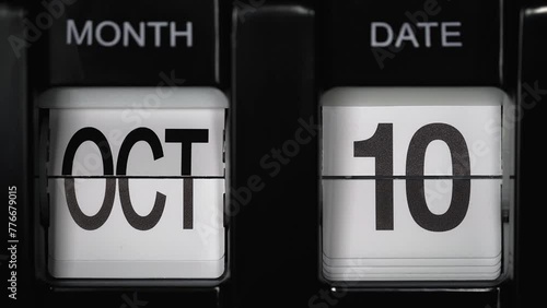 retro flip calendar with a date change from the ninth of October to the tenth of October. daily calendar with a change of days of the month. close up.