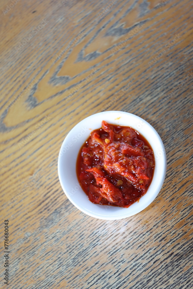 indonesian traditional red chili sauce sambal in a white bowl indonesian traditional red chili sauce sambal in a white bowl