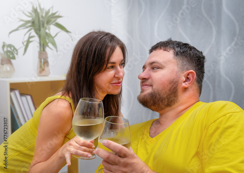 Portrait of a couple drinking wine looking at each other