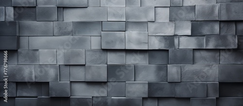 Metal blocks arranged closely together form a solid wall surface in a close-up view