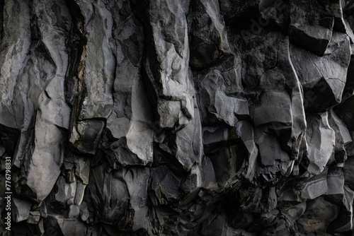 Close up of a bedrock formation inside a cave, showcasing intricate patterns and textures of the rock wall. Monochrome photography highlights the monochrome colors of the outcrop