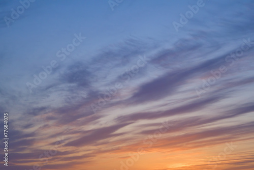 Summer evening sky in the picturesque clouds  lit by the rays of the setting sun.