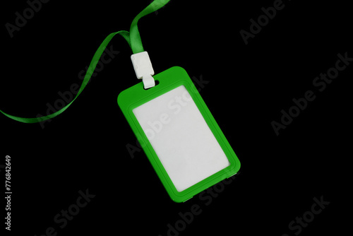 Green blank badge isolated on black background. 