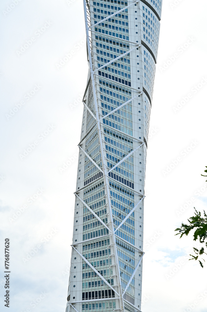 Turning Torso Malmö, famous skyscraper with rotating facade in Summer with blue sky in Malmö, Skane Sweden (3866) Turning Torso Malmö, famous skyscraper with rotating facade in Summer with blue sky in Malmö, Skane Sweden (3866)