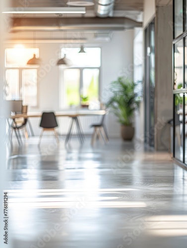 A blurred photo of a modern bright office space with fancy stylish interior © shooreeq