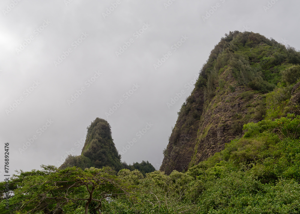 Stunning view of the Iao Needle State Monument vegetation covered lava remnant on the island of Maui , Hawaii, USA