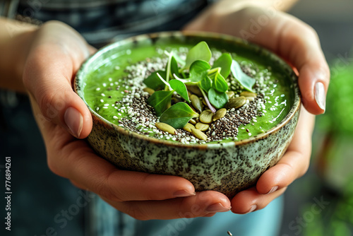 Hands hold smoothie bowl sprinkled with protein-packed hemp seeds into, adding a healthy crunch and a burst of essential nutrients.