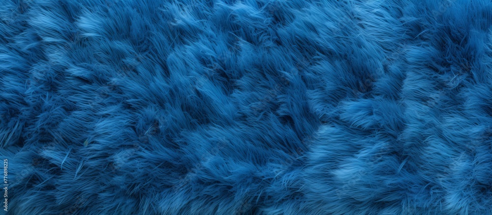 Obraz premium Close-up view of a detailed blue fur texture, showcasing its softness and vibrant color